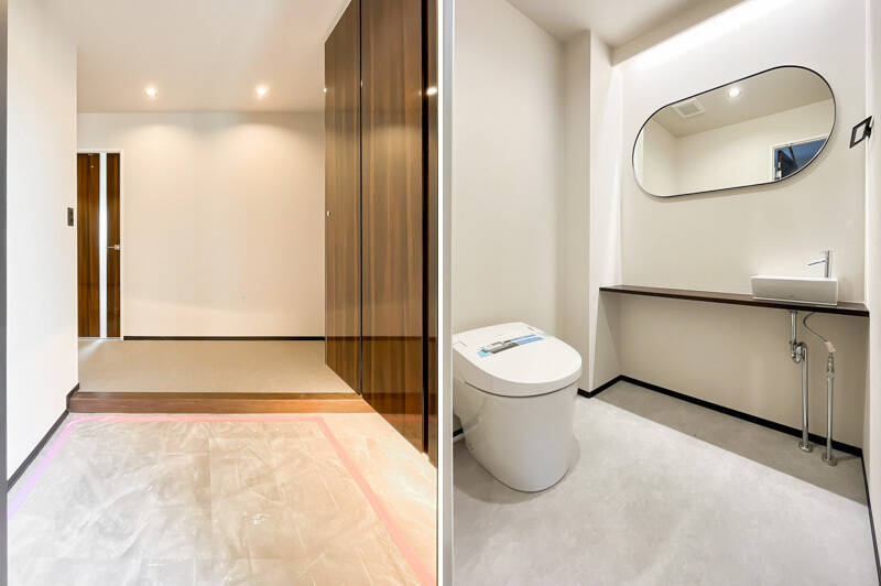 広い玄関ホールからスタイリッシュな鏡と手洗いカウンターが付いたトイレへアクセスできます。