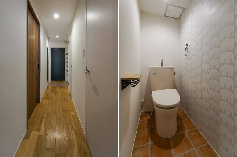 <b>左・</b>LDKを背にして廊下を見たカット。右側にトイレと水まわりが並んでいます。／<b>右・</b>トイレの壁紙はゾウの群れです。お好みに合わせて貼り替えることも可能ですが、せっかくなのでこの遊び心を引き継ぐのも、暮らしが明るくなっていいのでは。