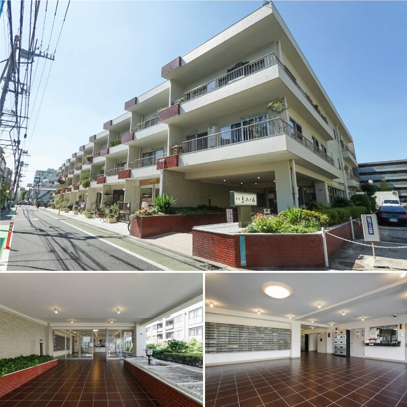 1974年竣工、総戸数151戸のビッグコミュニティ。道路に沿って並ぶ雁行(がんこう)したバルコニーが印象的な低層棟と、その奥に建つ高層棟に分かれています。白い外壁に赤いレンガタイル貼りの外観や、エントランスホールのバーガンディの床など、この年代のマンションならではの素敵な風合いです。