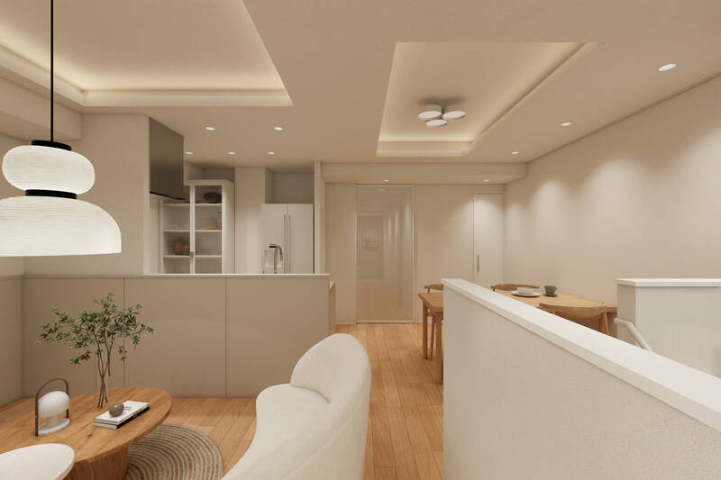 窓を背にしたカット。ライトグレージュを基調とした内装で、間接照明を仕込んだ折り上げ天井がアクセントに。