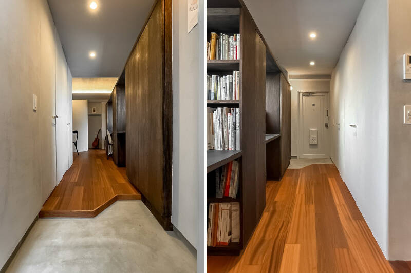 玄関扉を開けると、作業机と一体となった壁面収納がずらり。突き当たりまで視線がスッと抜けます。