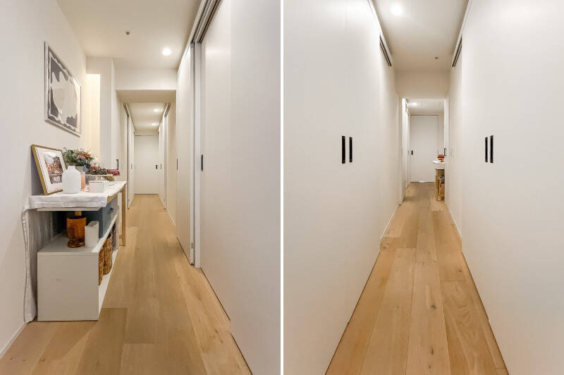 廊下の壁天井はすべて白。廊下にはファミリークローゼットとして使えそうな広いウォークインクローゼット（WIC）、ほか収納が2箇所設けられています。