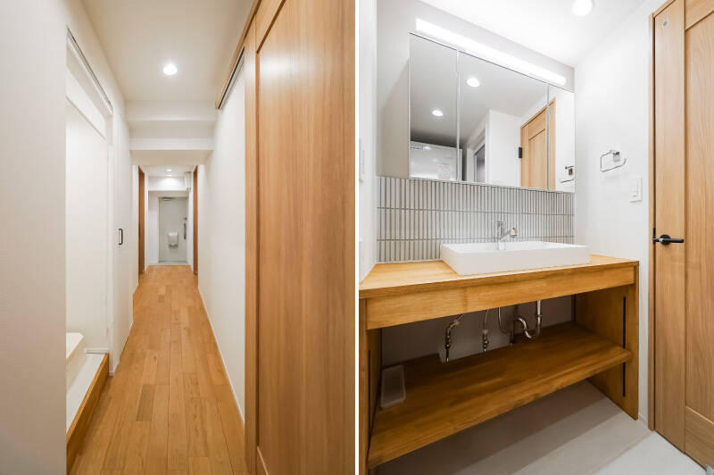 <b>左・</b>LDKを背に玄関までを見渡したカット。洋室B、水まわり、洗濯機置き場が並んでいます。/<b>右・</b>洗面化粧台はシンプルかつ隙のないデザイン。下部は収納スペースとなっています。