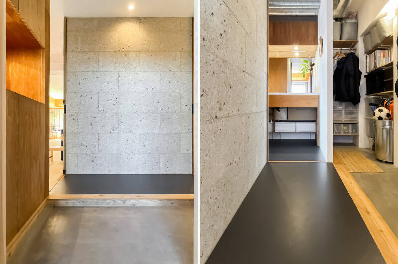 入ると正面には大谷石の壁面、左手には木製の下足入れ。横長の土間を上ると、右手には洗面台が見えます。