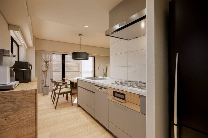 キッチンは食洗機付きで、グレーとシルバーを基調としたスタイリッシュなデザイン。背面には調理家電用の棚を置ける余白があります。また、生活感を抑えられるよう、冷蔵庫置き場はリビングダイニングから目が届かない位置に。