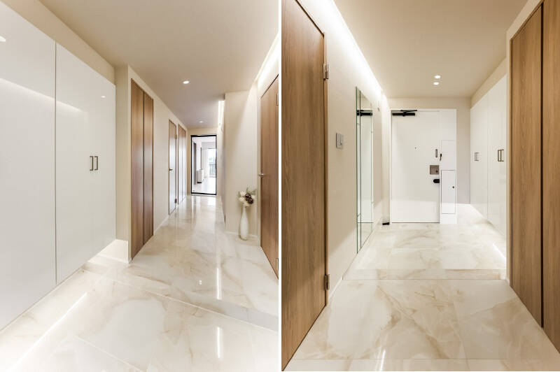 玄関は大理石調のタイルで艶やか。下足入れの対面には姿見が設置されています。