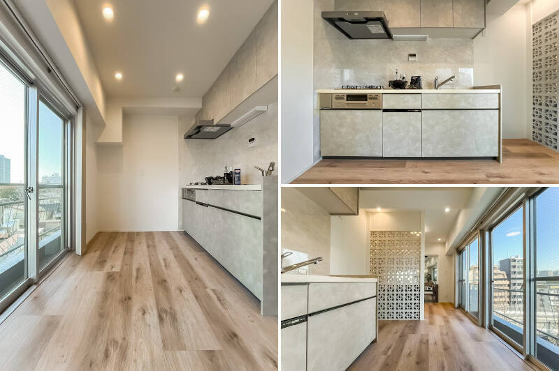 キッチンは3口コンロで食洗機付き。ライトグレーの面材とデザインウォールの組み合わせが特徴的な佇まいです。