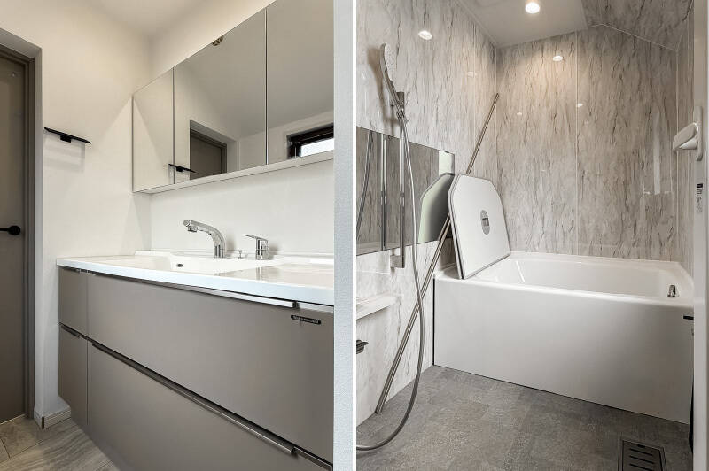 <b>左・</b>グレーが基調の洗面台。／<b>右・</b>洗面台の奥にはややコンパクトなユニットバスが。浴室乾燥機と追い焚き付きです。