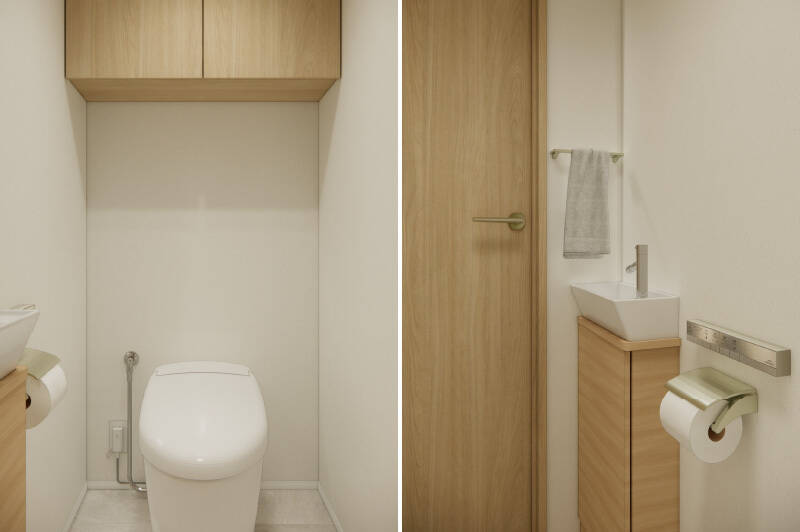 トイレは廊下からアクセス。スタイリッシュなタンクレスタイプで、上部には吊り戸棚、小さな手洗い器が付いています。