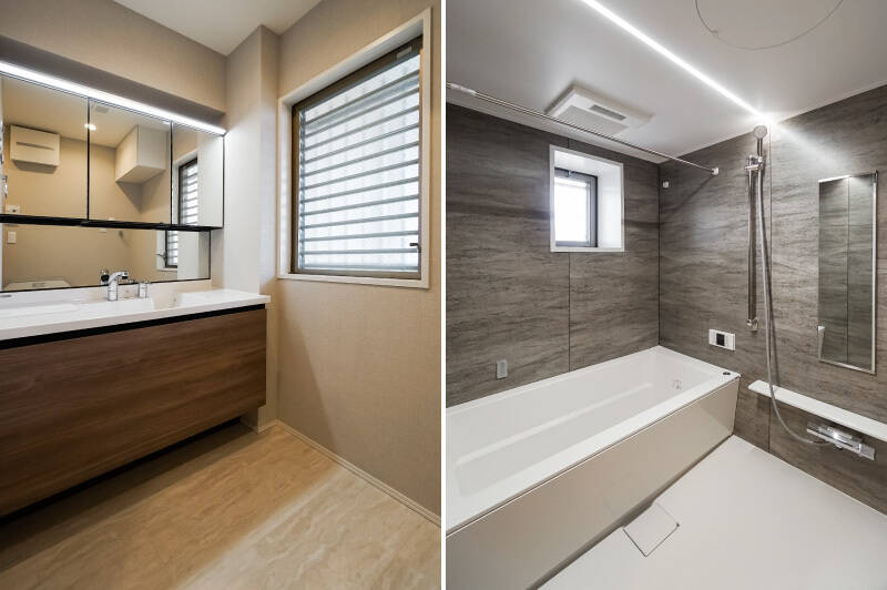 <b>左・</b>洗面化粧台がワイドで収納たっぷりなのは、快適なファミリーライフのための必須ポイント◎ 共用廊下に面した大きなガラスルーバー窓があり、簡単に空気の入れ替えが可能です。/<b>右・</b>広々とした浴室換気乾燥機付きのグレーのバスルーム。お子さまと一緒でも余裕をもって入れそうですね。こちらにも窓があってGOODです!