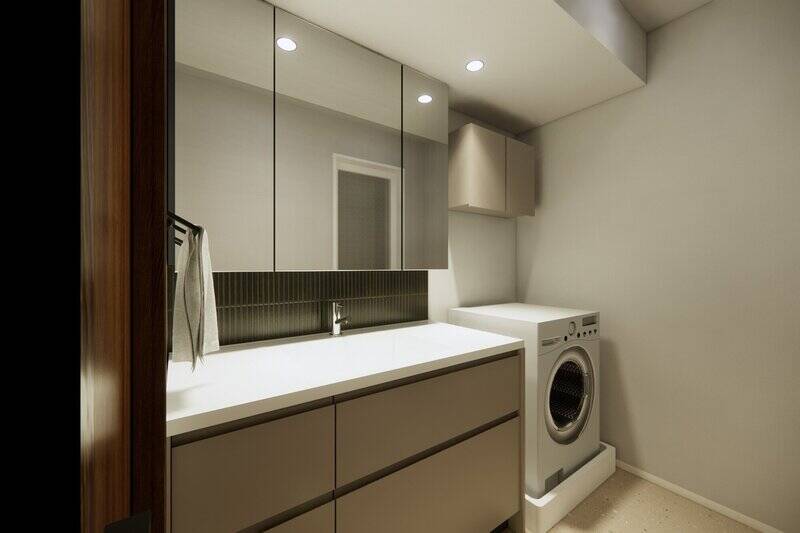 キッチンと同じダークトーンのタイルがアクセント。洗濯機置き場の上には扉付きの収納を設けます。