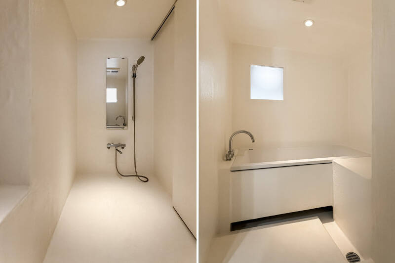 なんだこのバスルームは……! 職人さんが防水工事を施し、手造りされた “在来工法” の浴室です。広いシャワースペースの奥に浴槽が。