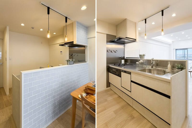 ツヤ感のあるグレーのタイルがあしらわれた対面キッチン。リビングダイニング（LD）からは腰壁によって内部が見えづらく、生活感がグッと抑えられています。グリル付き3口コンロ、食洗機、浄水器を搭載。