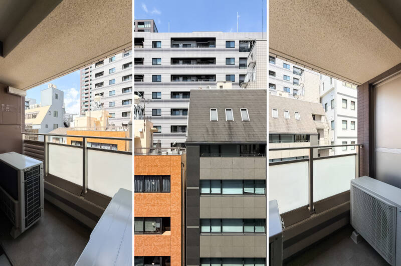 給湯器や室外機でほぼ一杯のサイズ感。正面にはビルが建ち並んでいます。