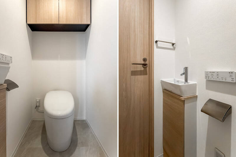 トイレは廊下からアクセス。スタイリッシュなタンクレスタイプで、上部には吊り戸棚、小さな手洗い器が付いています。