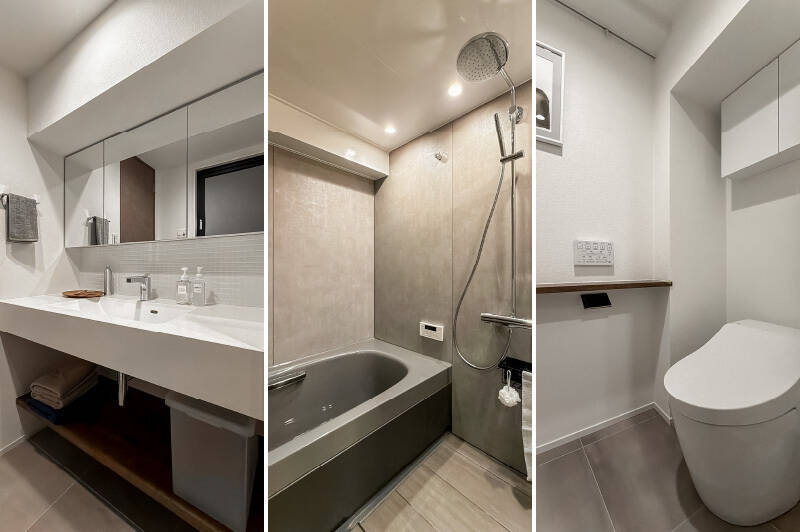 <b>左・</b>洗面台はややワイドな造りで、スペースに余裕があります。モザイクタイルからカウンタートップまで白で統一されており、清潔感のあるデザイン。／<b>中央・</b>バスルームは1616サイズで、ゆったりとした空間。オーバーヘッドシャワーが採用されたホテルライクな仕様です。／<b>右・</b>トイレはタンクレス。ピクチャーレールが備わっているので、お好みのアートを飾ってみてください。