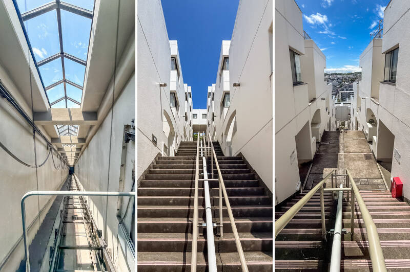 ゆっくり上るエレベーター内部からは街並みが見晴らせます。12階で下車して階段をワンフロア分上がると、ようやく住戸の玄関前に到着です。