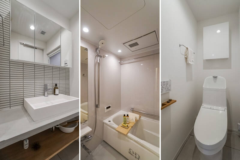 <b>左・</b>キッチンとお揃いのタイルをあしらった洗面化粧台。モルタル仕上げの造作カウンターがいい雰囲気です！／<b>中央・</b>バスルームは1317サイズ。浴室乾燥機完備です。／<b>右・</b>シンプルな造りのトイレですが、さりげなくペーパーホルダーがまた、木製なんですよ……細部まで天然素材へのこだわりを感じますね。