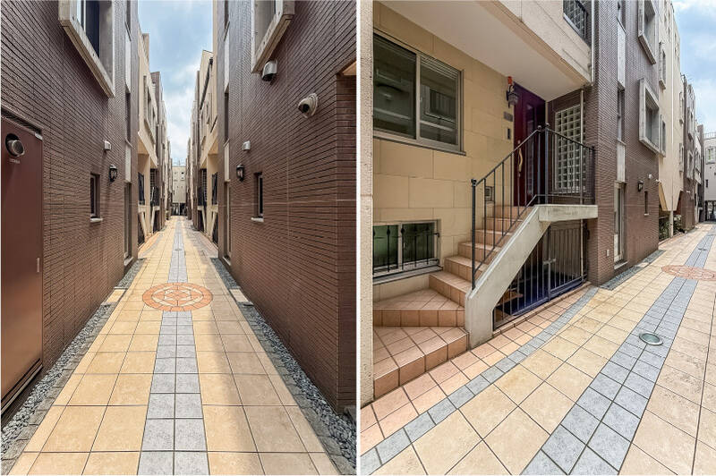 タイル敷きの共用廊下を進んでいくと、今回ご紹介する住戸に到着！ 階段を数段上って、住戸内を見ていきましょう。